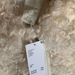 Faux fur white coat from Urban Outfitters. Never worn size XS tags still on